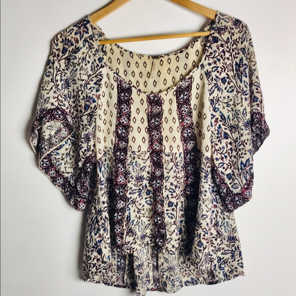 Free People-Hi Low Top In Size medium.